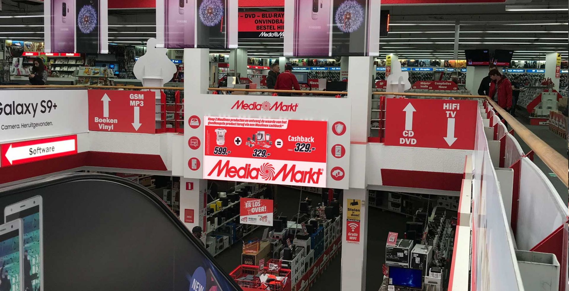 a store with a sign and a couple of people