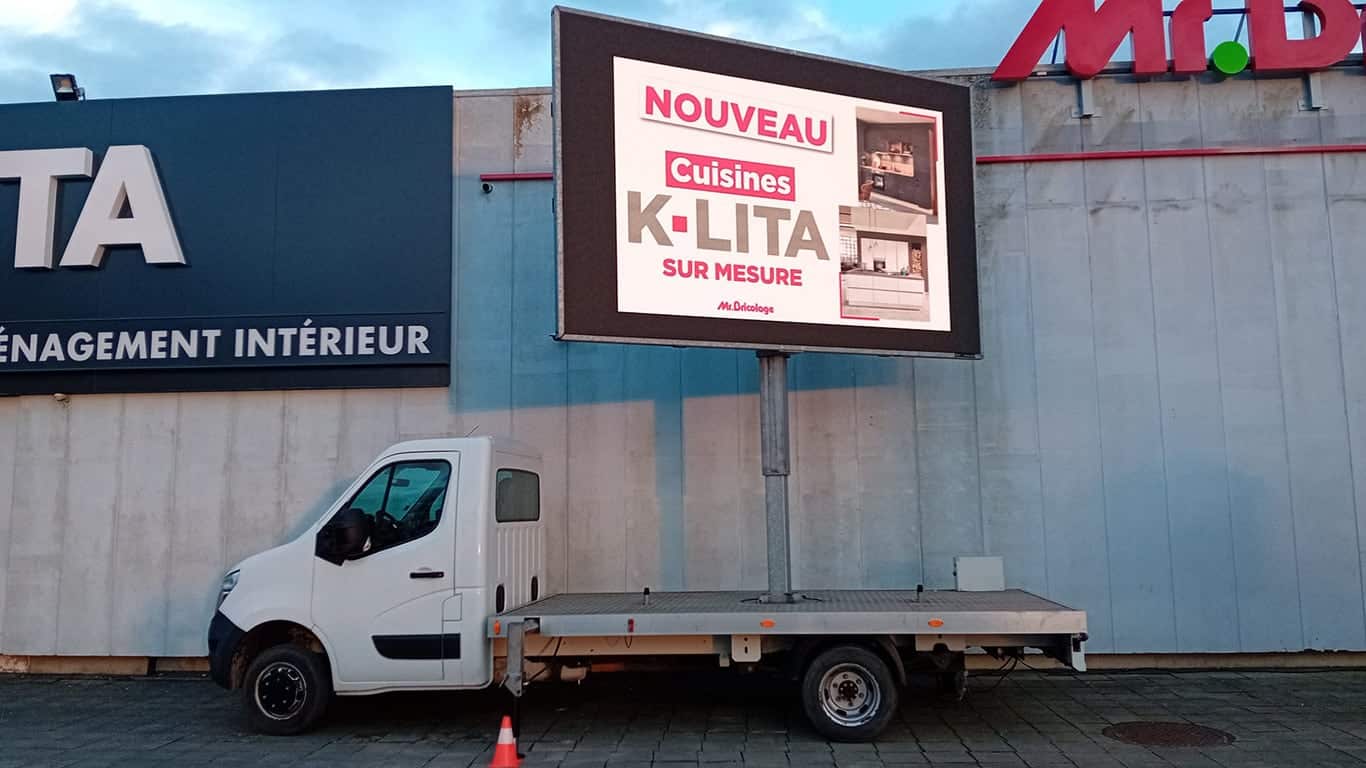a truck parked in front of a building