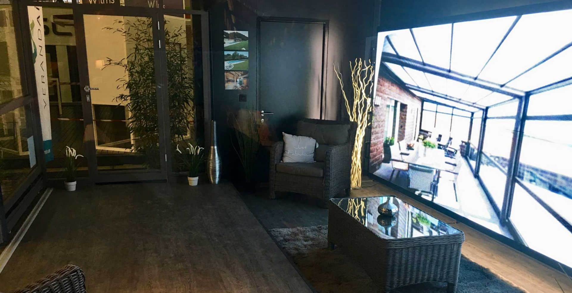 a room with a glass door and a chair