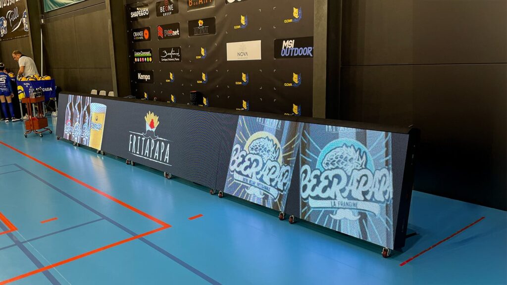 a large screen with a logo on it