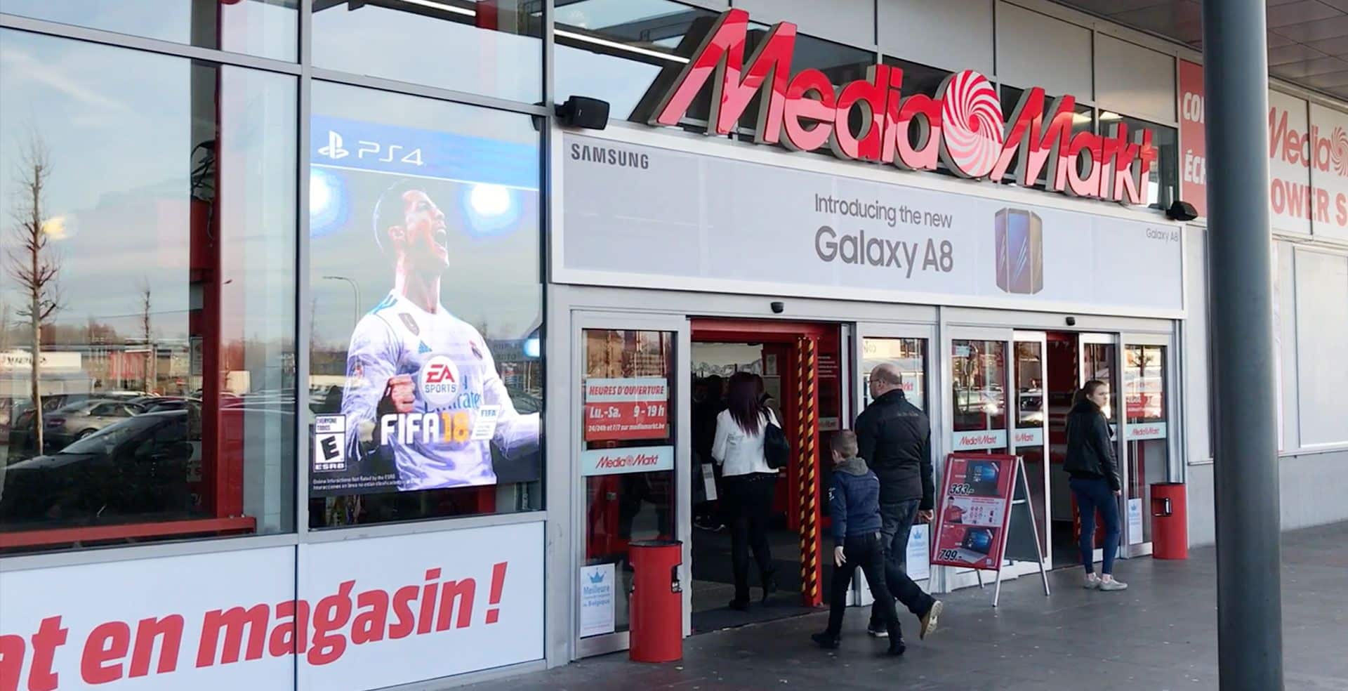 a store front with people walking out of it