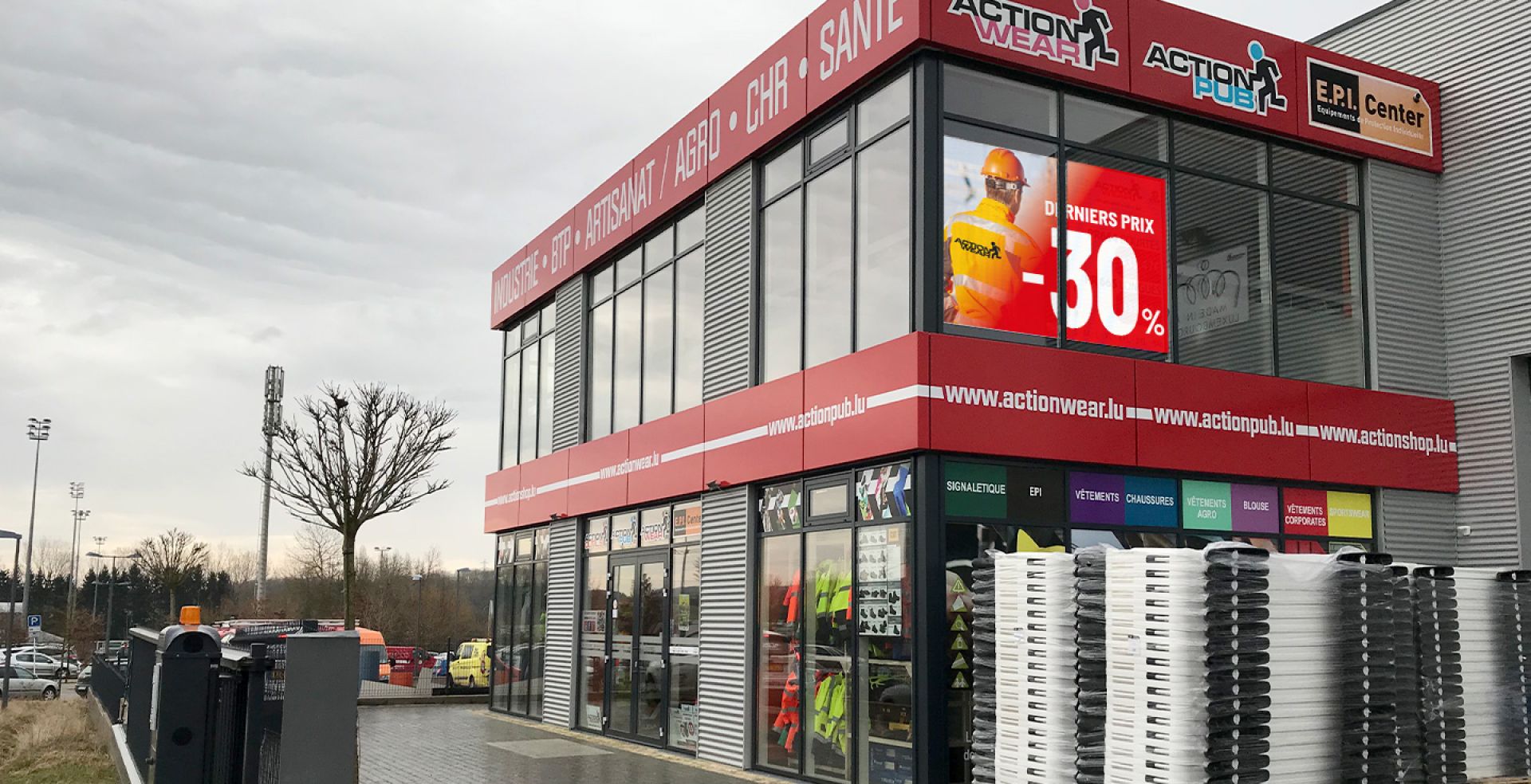 a store front with a lot of items on the side